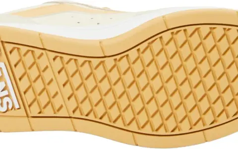 Suela de zapatilla Vans con patrón de rombos y logo blanco. Ideal para tu guía de tallas Vans.