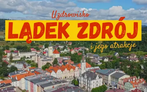 Widok na urokliwy rynek w Lądku Zdroju, z kolorowymi kamieniczkami i zabytkowym ratuszem.