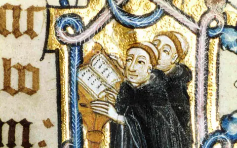 Illuminated manuscript shows Benedictine monks studying a book, illustrating how Benedictine monks spent their time in prayer and learning.