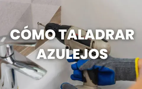 Mano con guantes usa taladro para taladrar azulejo.