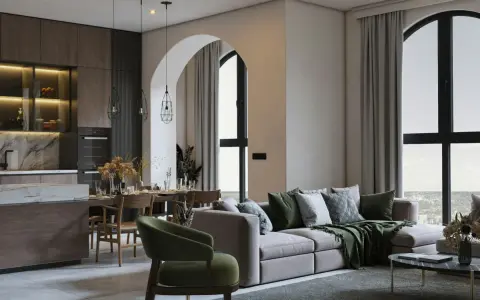 Un soggiorno con cucina open space, un divano moderno e un tavolo da pranzo. L'arredamento casa moderno crea un ambiente accogliente.