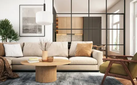 Gemütliche wohnideen wohnzimmer: Beige Sofa, Holztisch, grüner Sessel und eine offene Küche hinter Glas.