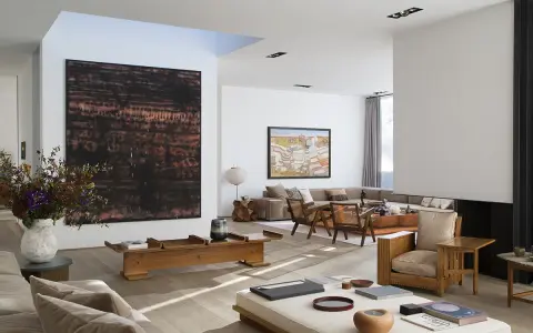A spacious living room with modern art, including a large abstract piece by tiqui atencio.