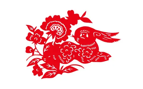 Czerwone wycinanki z papieru przedstawiają królika wśród kwiatów. Rok 1975 jaki to rok chiński? To rok Królika!