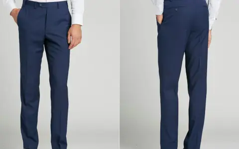 Front and back views of navy blue dress pants. These pants are tailored for a clean look, demonstrating the unhemmed pants meaning of a raw edge ready for custom fitting.