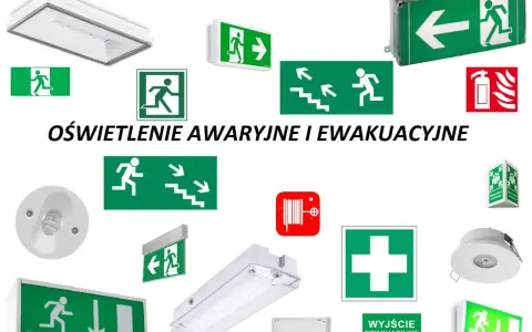 Różnorodne znaki ewakuacyjne i oświetlenie awaryjne, w tym zielone tablice z piktogramami biegnących ludzi i strzałkami, sygnalizujące drogi ewakuacyjne.