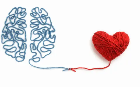 Cervello di filo blu collegato a un cuore di filo rosso. Un elenco di sentimenti ed emozioni che uniscono mente e cuore.