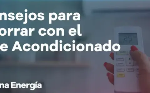 Consejos para reducir el consumo de aire acondicionado. Una mano sostiene un control remoto, mostrando la temperatura.