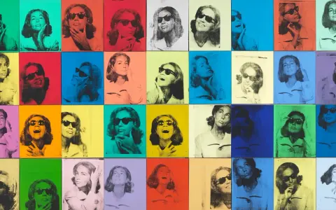 Andy Warhol pop art painting featuring a woman in sunglasses repeated in a grid of vibrant, contrasting colors.