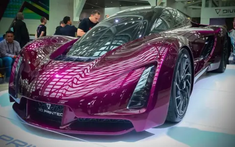 A stunning purple concept car, showcasing the future of automotive 3d printing with its sleek, futuristic design.