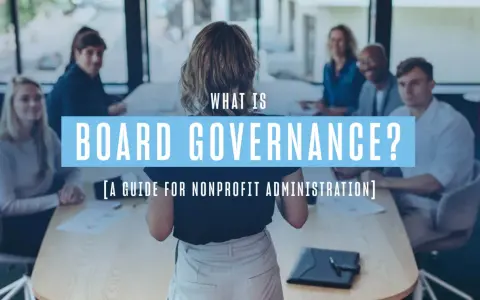 A group discusses board governance, a guide for nonprofit administration, in a meeting.