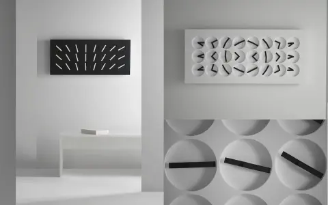Orologio muro design minimalista, con quadrante nero e lancette bianche, e un altro con quadrante bianco e lancette nere.