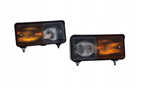 Dwa nowe klosze lampy Ursus C-360, każdy z pomarańczową i przezroczystą częścią, gotowe do montażu.