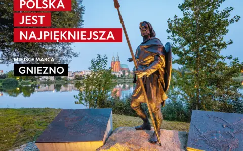 Pomnik w Gnieźnie, nawiązujący do legendy o orle białym. W tle jezioro i katedra.