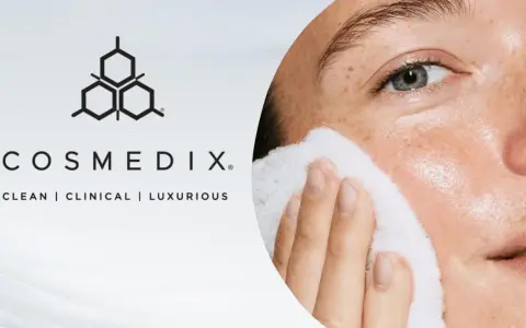 A woman's face is gently cleansed with a white pad, showcasing the benefits of enzyme exfoliation for radiant skin.