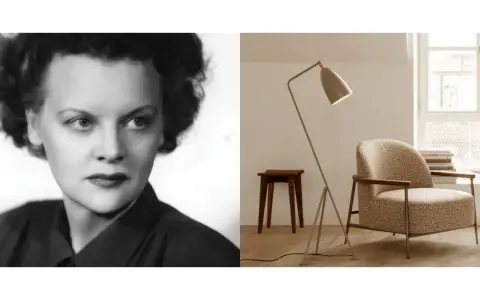 Porträtt av Greta Magnusson Grossman bredvid en av hennes ikoniska golvlampor och en fåtölj i en modern inredning.