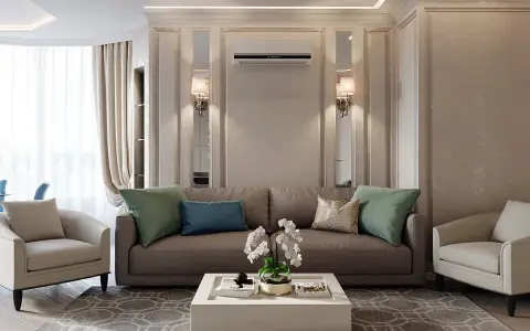 Soggiorno elegante con divano marrone, poltrone beige e tavolino bianco. Un perfetto esempio di arredamento contemporaneo chic.
