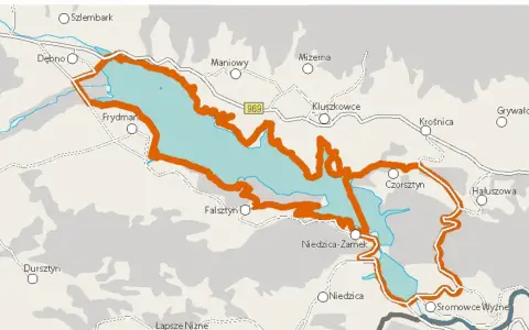 Mapa z zaznaczoną pomarańczową obwódką wokół jeziora. Widoczne miejscowości: Czorsztyn, Niedzica, Frydman. Idealna velo czorsztyn trasa.