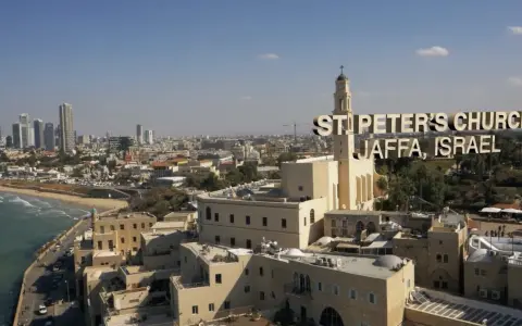 St. Peter's Church in Jaffa, Israel, a city with deep roots in the bible, overlooks the Mediterranean Sea and a modern skyline.