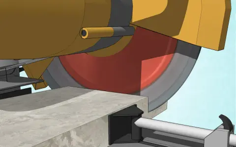 Máquina amarilla cortando hormigón con disco radial.