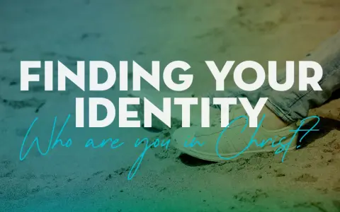 Finding your identity in Christ. A person sits on sand, wearing jeans and sneakers, with text overlay asking "Who are you in Christ?".