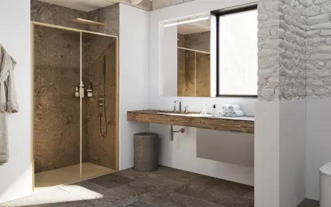 Bagno moderno con nicchia doccia in muratura effetto pietra, lavabo in legno grezzo e dettagli rustici.