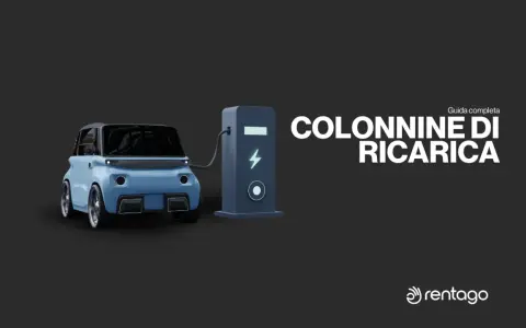 Auto elettrica blu collegata a una colonnina di ricarica. Guida completa ai punti ricarica auto elettriche.