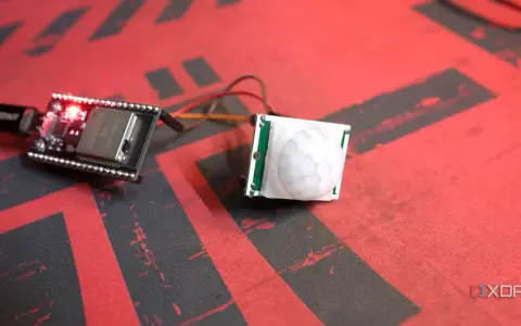 ESP32 board connected to a PIR motion sensor, ready for esp32 presence detection projects.