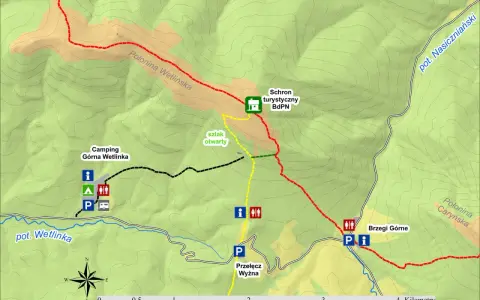 Mapa turystyczna z zaznaczonymi szlakami, schroniskiem, campingiem i Przełęczą Wyżniańską.