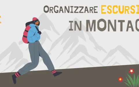 Organizzare un'escursione in montagna è un'avventura entusiasmante. Una persona con zaino cammina tra le vette innevate.