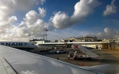 Pisa International Airport, the closest airport to Cinque Terre, with a Ryanair plane on the tarmac.