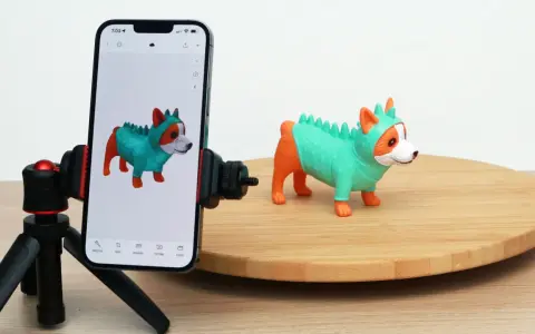 A phone on a tripod captures a toy dog, demonstrating 3D scanning for 3D printing.
