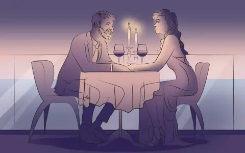 Romantyczna kolacja przy świecach. Para trzyma się za ręce, celebrując rocznicę ślubu na wesoło.