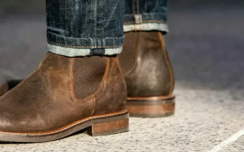 These rugged brown leather chelsea boots, paired with cuffed denim, prove that chelsea boots are in style and perfect for a casual yet sharp look.