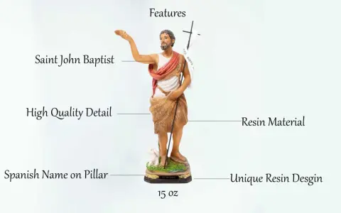 Escultura de San Juan Bautista, detallada y hecha de resina. Incluye un cordero y una cruz con estandarte.