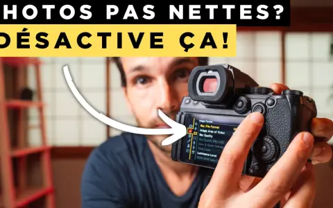 Un homme ajuste les réglages d'un appareil photo, l'écran affiche "Rec. File Format". Il désactive l'auto focus pour des photos nettes.