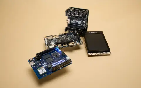 An Arduino Uno, a Bela GEN MULTI, and a Fruit Jam RP2350 board are arranged on a beige surface, showcasing some of the best microcontroller options for makers.