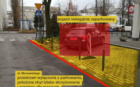 Nielegalnie zaparkowany pojazd na ul. Morawskiego. Przestrzeń wyłączona z parkowania, zbyt blisko skrzyżowania i przejścia dla pieszych.