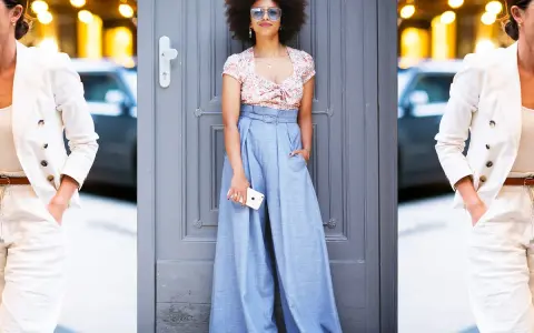 Moda: pantaloni high waist significato. Due donne con outfit eleganti, una con blazer bianco e pantaloni chiari, l'altra con crop top floreale e ampi pantaloni azzurri.