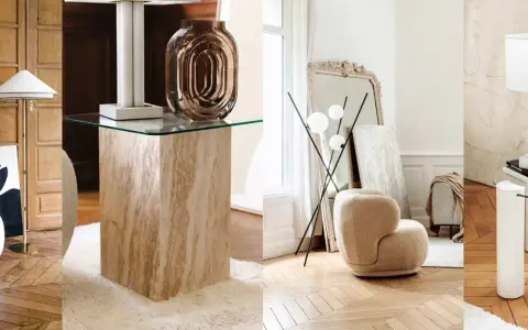 Arredamento vintage casa: poltrone soffici, tavolini in travertino e vetro, lampade di design e specchi antichi creano un'atmosfera accogliente.