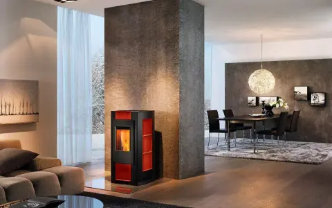 Estufa moderna de pellets, que son los pellets, calienta un salón con chimenea y comedor.