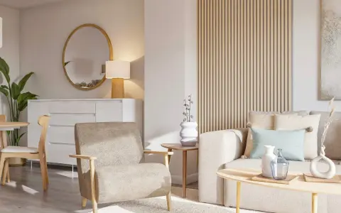 Salón acogedor con sofá y sillón en tonos tierra, mesa de centro de madera y detalles decorativos en colores neutros.