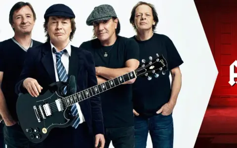 Fünf Musiker der legendären AC/DC, bekannt für ihre Hardrock-Musikrichtung, posieren mit Gitarren.