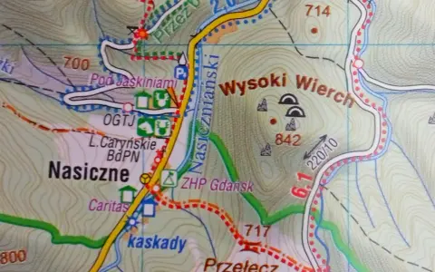 Mapa turystyczna Bieszczadów z zaznaczonymi szlakami, punktami widokowymi i jaskiniami. Widoczne nazwy: Nasiczne, Wysoki Wierch, Pod Jaskiniami.