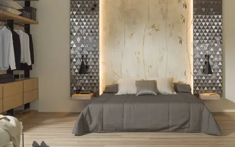 Habitaciones sin cabecero: cama con edredón gris, almohadas y papel tapiz de bambú. A la izquierda, armario abierto con ropa.