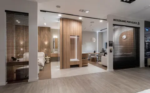 Nowoczesne mieszkanie pod klucz: sypialnia, łazienka i salon z jadalnią. Drewniane akcenty i minimalistyczny design.
