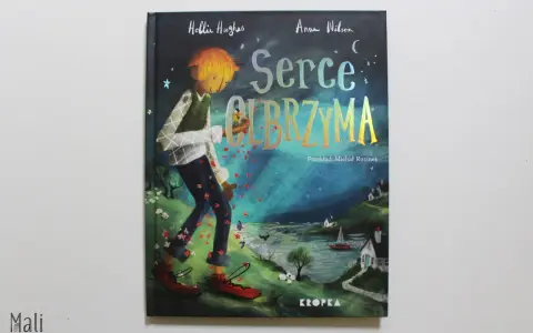 Ilustracja z książki "Serce olbrzyma": chłopiec z pomarańczowymi włosami idzie przez łąkę, zrzucając czerwone płatki.