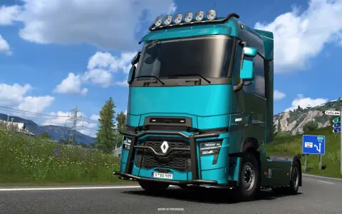 Turkusowa ciężarówka w Euro Truck Simulator 2 PS5 na górskiej drodze.