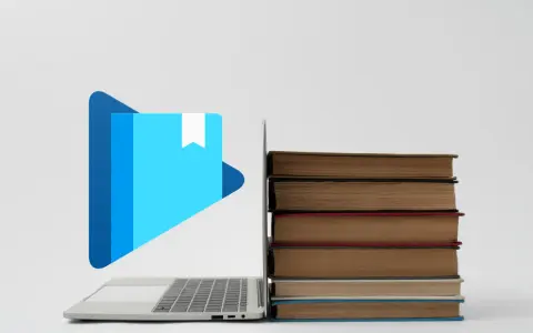 Laptop z ikoną książki i stosem książek. Jak otworzyć plik epub?