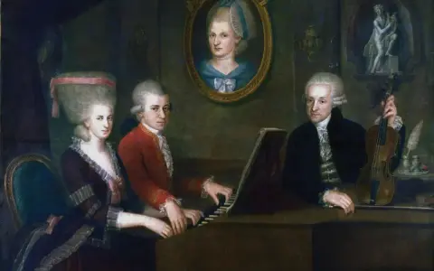 Portret rodziny Mozarta: Leopold, Wolfgang i Nannerl przy klawesynie. W tle portret Anny Marii Pertl.